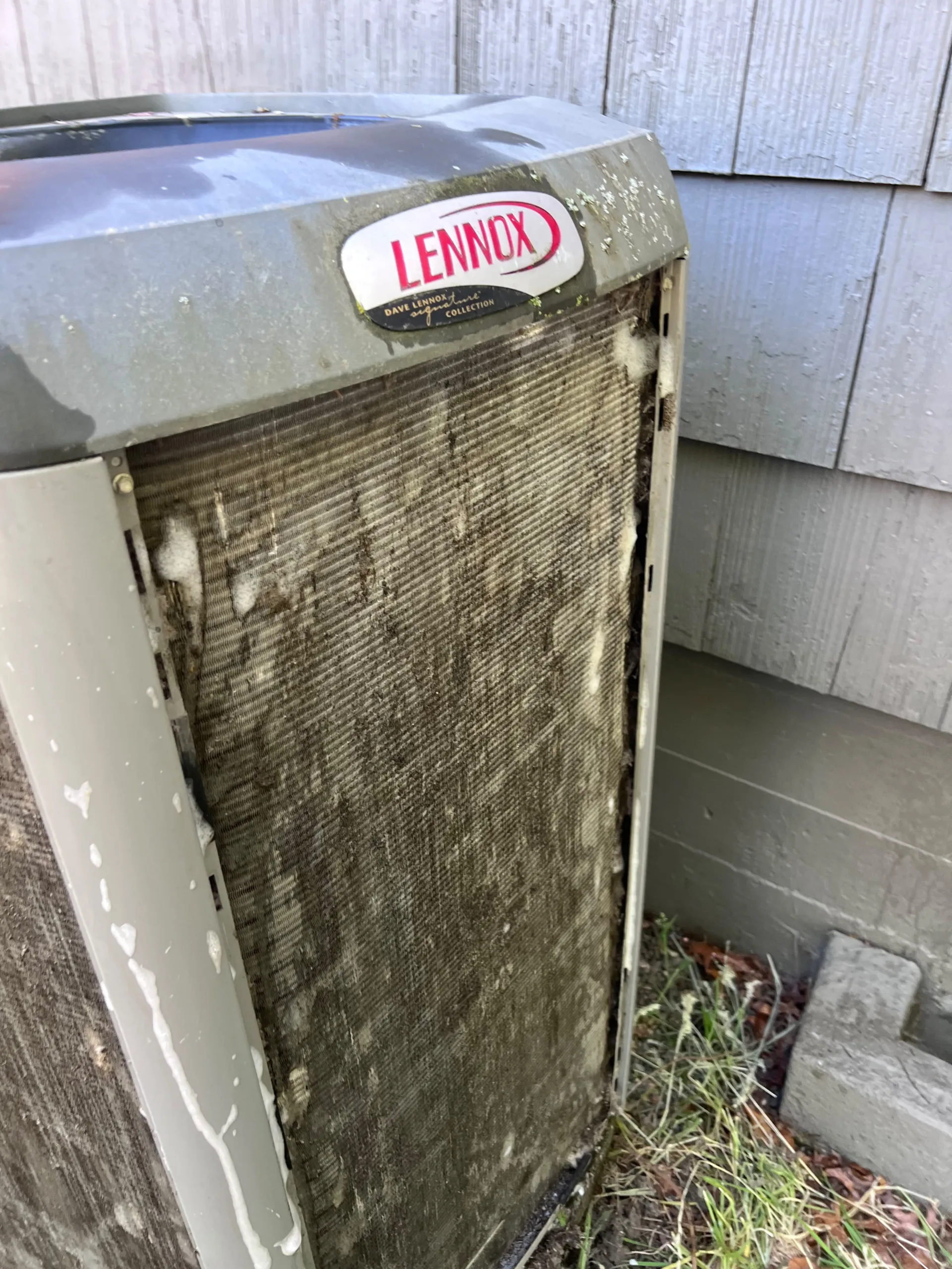 Lennox air conditioning unit with ice buildup on the outdoor coils, a warning sign of refrigerant or airflow issues.